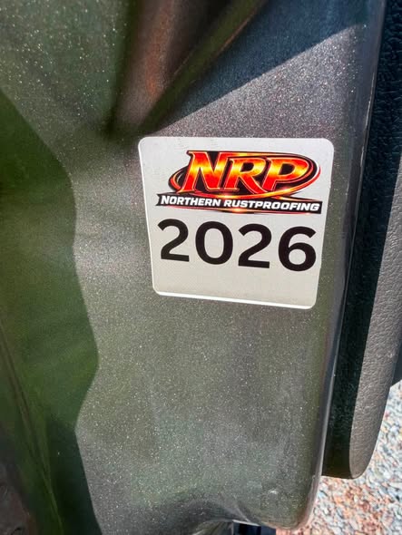 Northern Rustproofing dated service sticker applied inside a vehicle door jamb