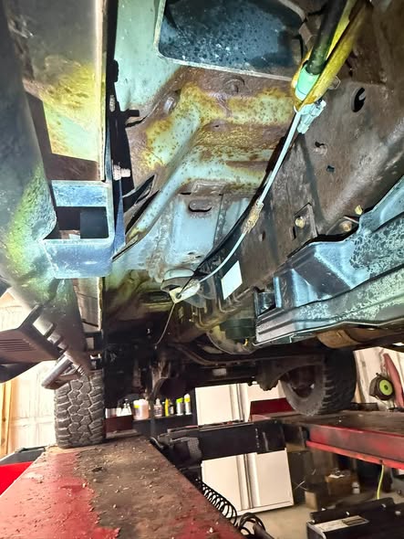 Corroded frame rail with flaking surface rust