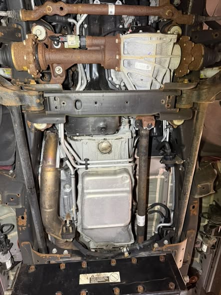 Heavily rusted driveshaft and undercarriage components on a customer vehicle